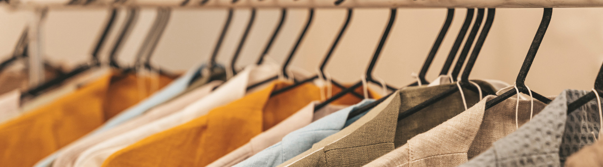 Clothes Hanging On Garment Rail