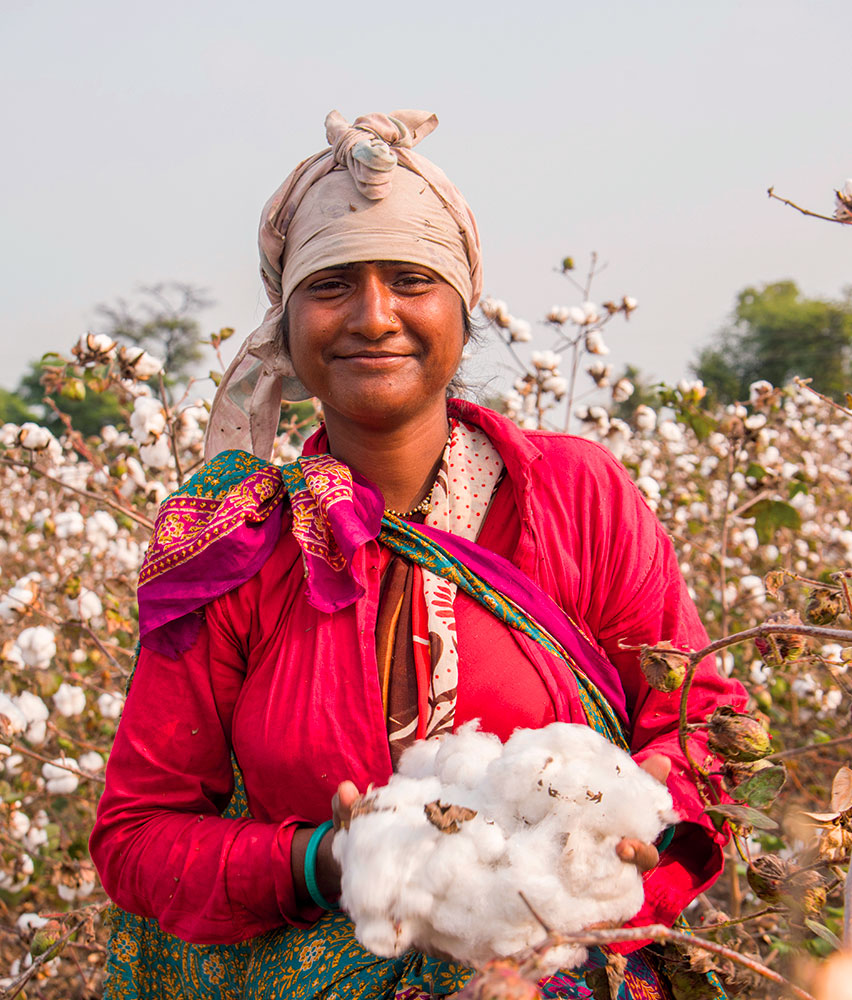 women smiling in cotton field